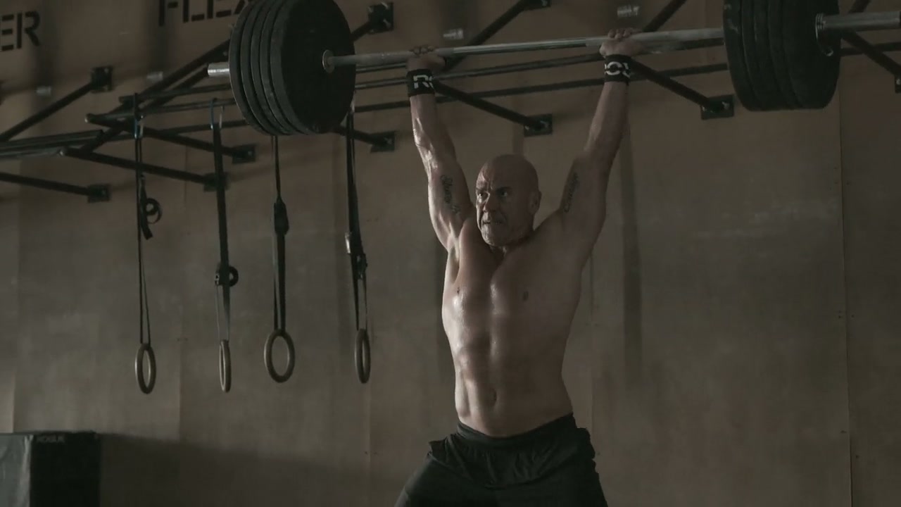 Athletes lifting weights and training on a Concept2 SkiErg